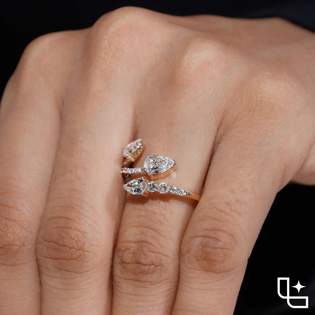 Three Stone Pear Cut Ring with Open Bypass Band and Pavé Accents