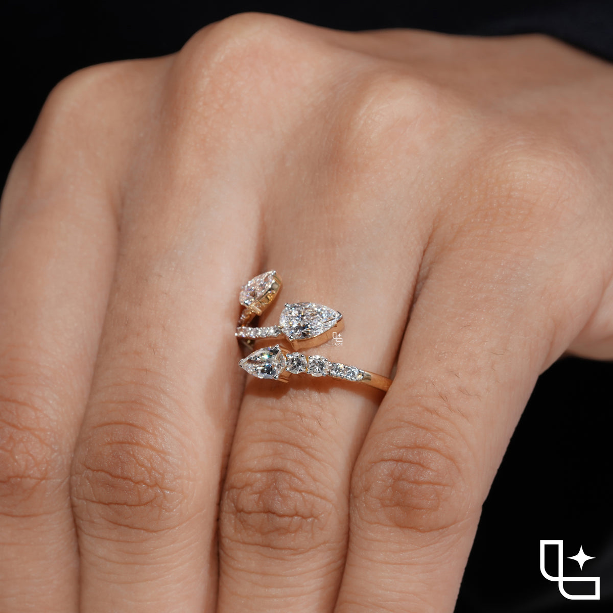 Three Stone Pear Cut Ring with Open Bypass Band and Pavé Accents