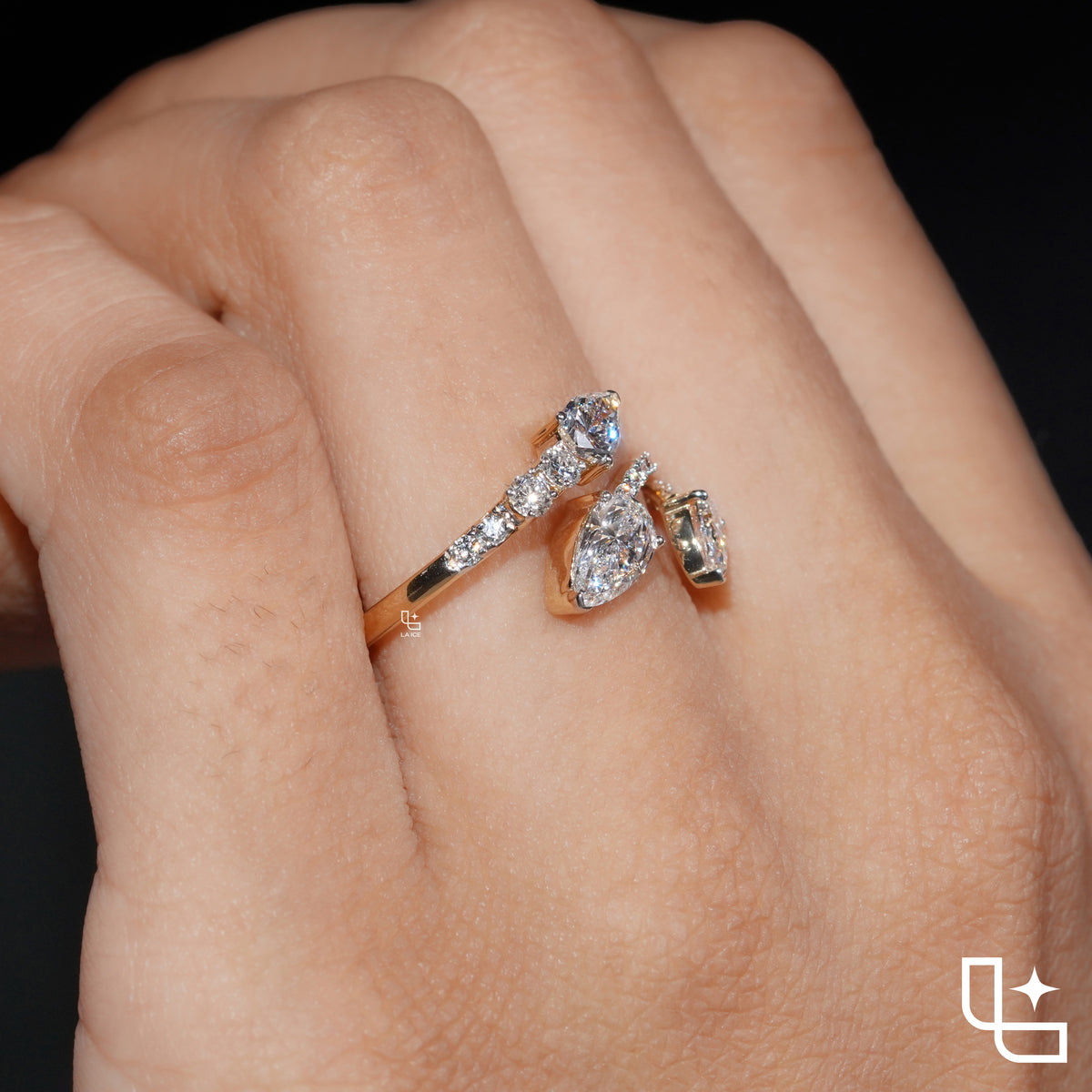 Three Stone Pear Cut Ring with Open Bypass Band and Pavé Accents