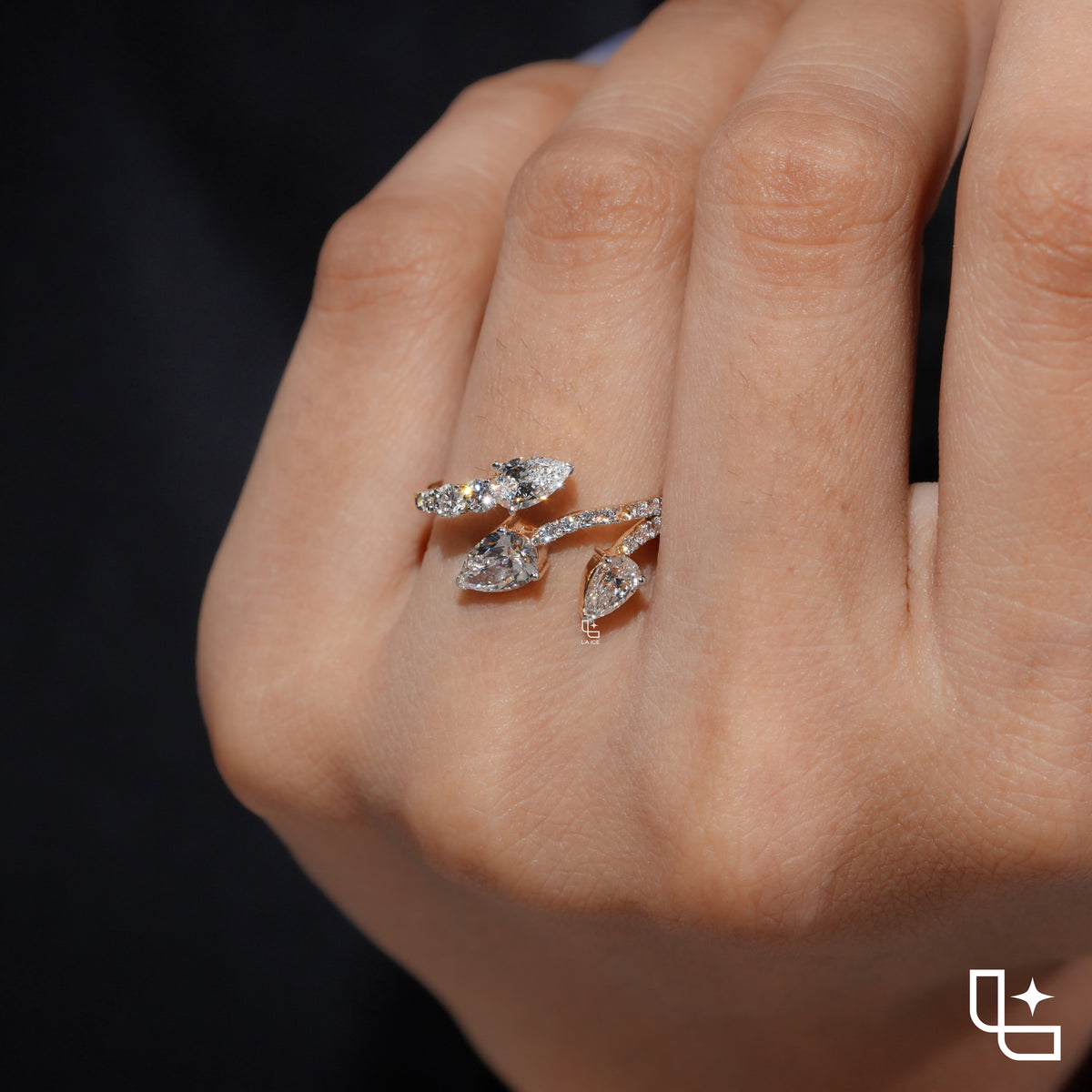 Three Stone Pear Cut Ring with Open Bypass Band and Pavé Accents
