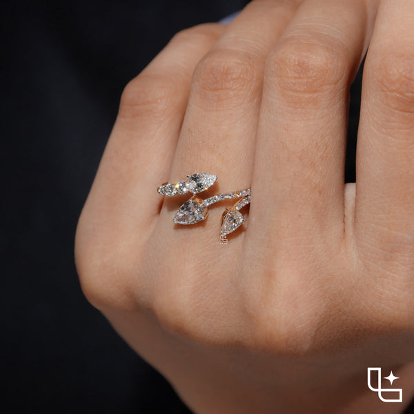 Three Stone Pear Cut Ring with Open Bypass Band and Pavé Accents
