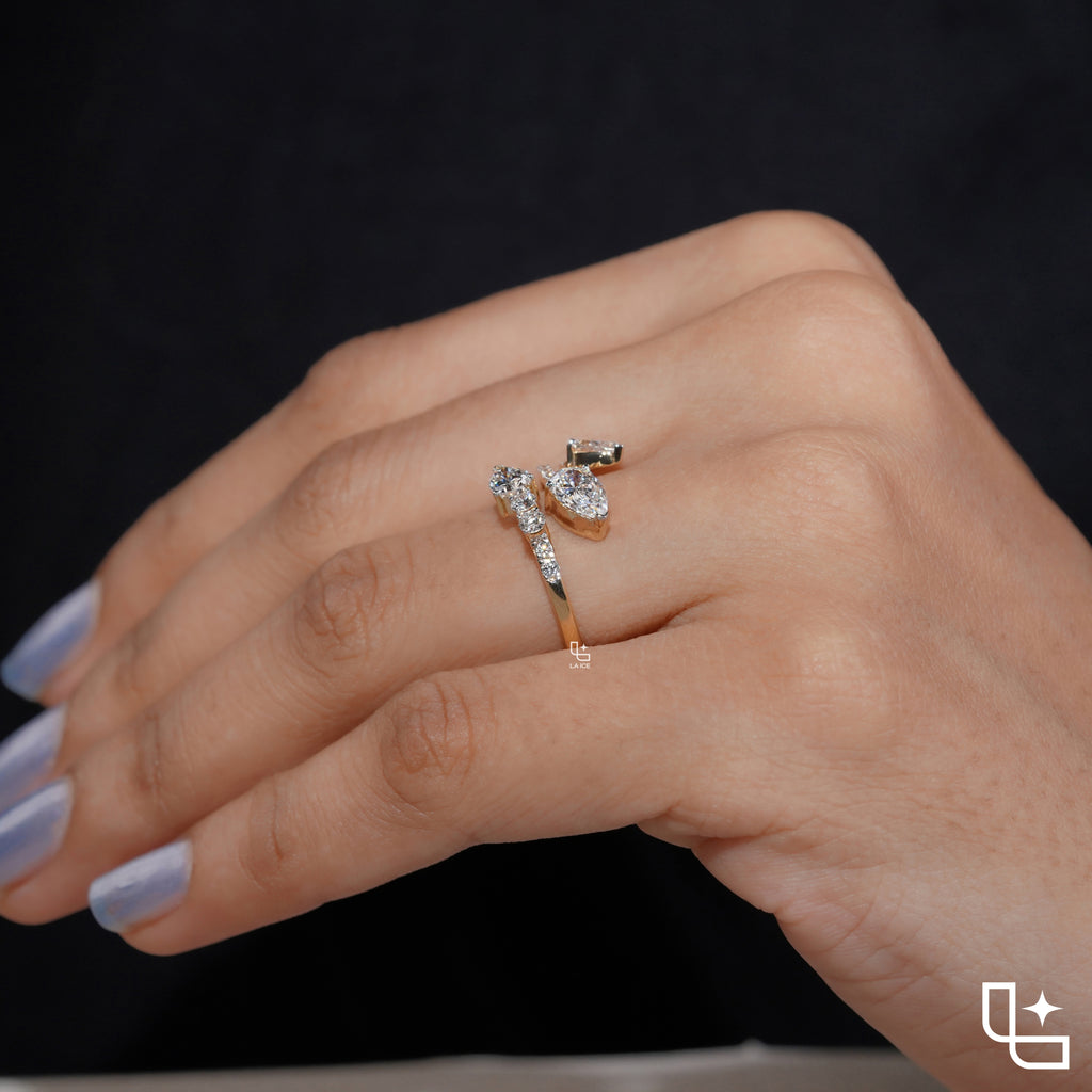 Three Stone Pear Cut Ring with Open Bypass Band and Pavé Accents