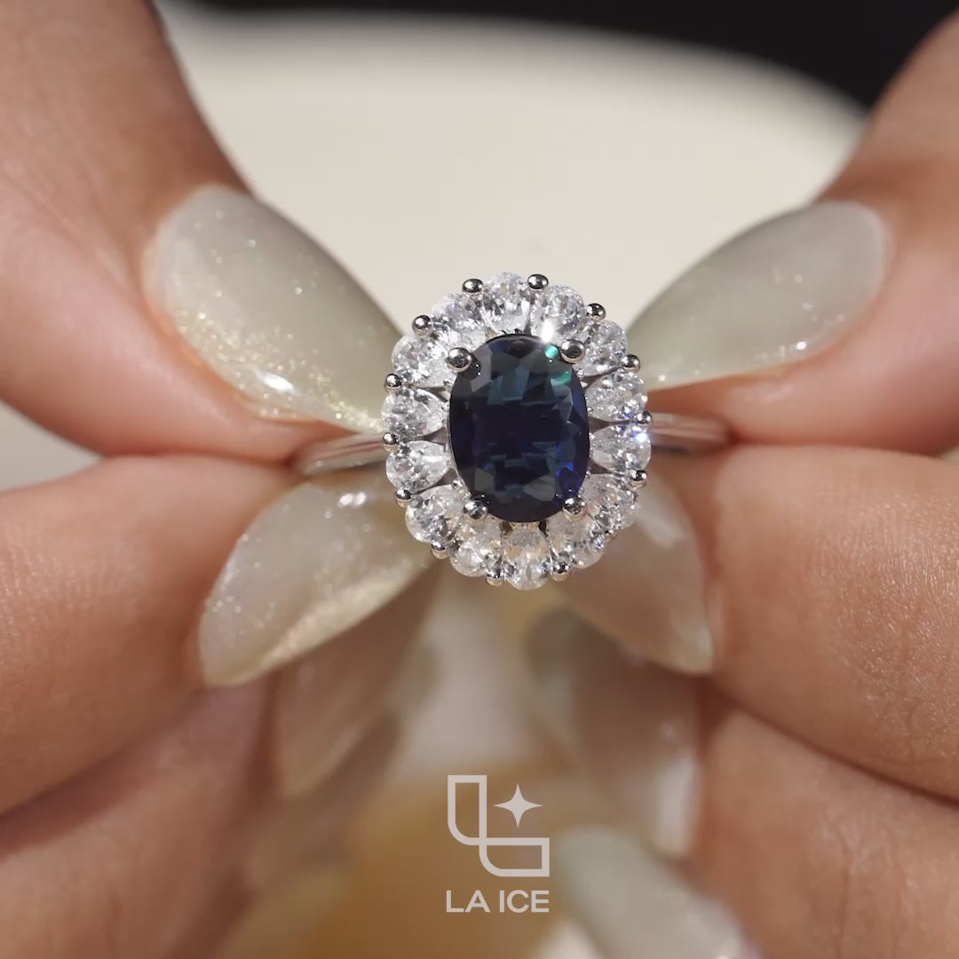 Blue Oval Halo Engagement Ring with Floral Accent Stones