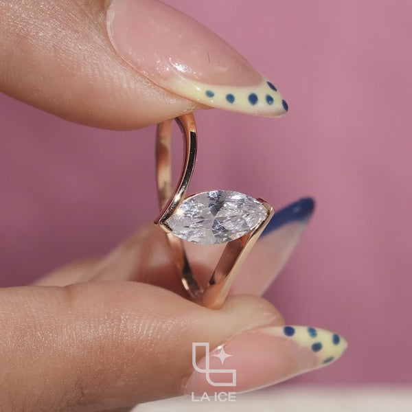 Marquise Cut Solitaire Engagement Ring with Modern Bypass Band Design