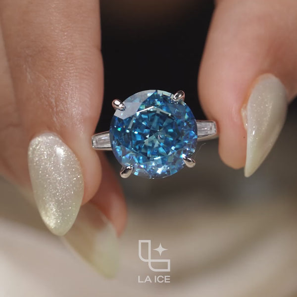 Round Blue Center Stone Solitaire Ring with Baguette Side Accents